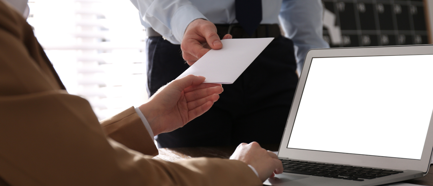 Man giving letter to boss